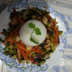 A picture of White rice with veggies.