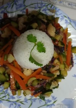 A picture of White rice with veggies.