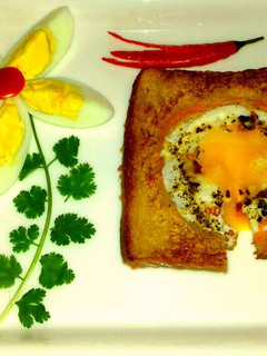 A picture of Half Fry Egg With Carrot Sandwich.