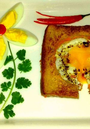 A picture of Half Fry Egg With Carrot Sandwich.