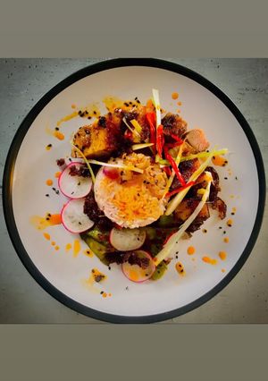 A picture of Sticky and Spicy Pork Belly with Lemon, Thyme and Red Onion Basmati Rice.