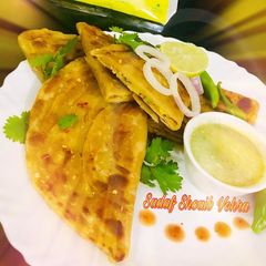A picture of D shaped Aloo Paratha /Aloo Paratha.