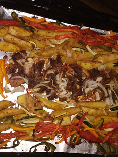 A picture of Easy beef and potatoe wedges with salad.