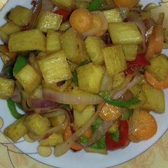 A picture of Fried yam n veggies.