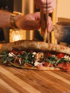 A picture of PANUOZZO (A PIZZA SANDWICH).