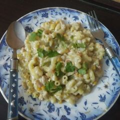 A picture of Macroni pasta in white sauce.