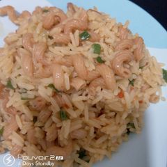 A picture of Jollof rice with fried macroni.