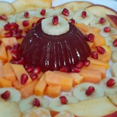 A picture of Strawberry jello with fruits.