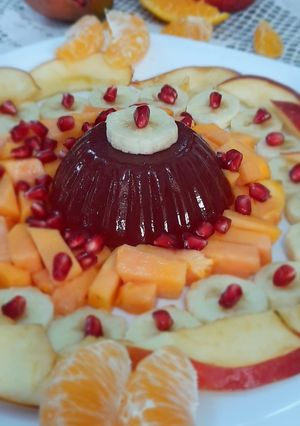A picture of Strawberry jello with fruits.