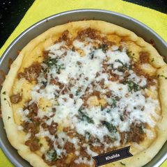 A picture of 3 spice butter garlic cheesy naan.