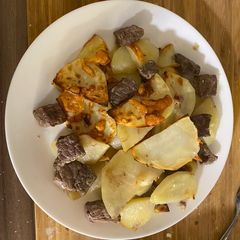 A picture of Baked meat/chicken/fish with potatoes in sour cream.
