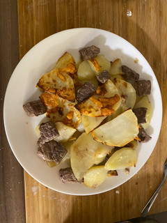 A picture of Baked meat/chicken/fish with potatoes in sour cream.
