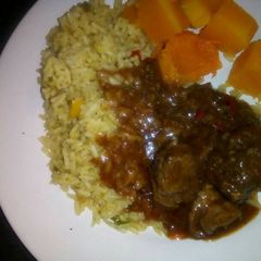 A picture of Beef stew with Rice.