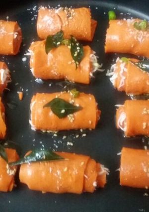A picture of Cheesy Beetroot khandvi roll.
