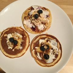 A picture of Low-fat pancakes with cream cheese, blueberries & hazelnuts.