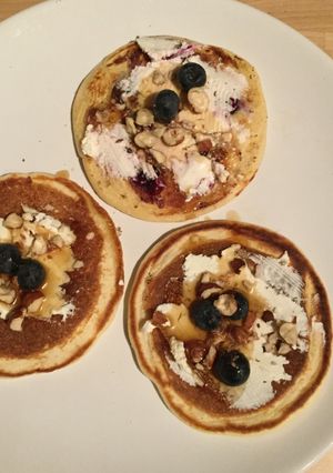 A picture of Low-fat pancakes with cream cheese, blueberries & hazelnuts.