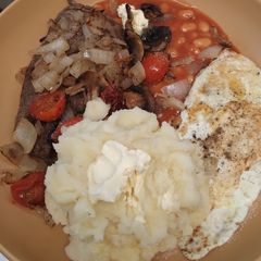 A picture of Gluten free Medallion steak with mash & beans.