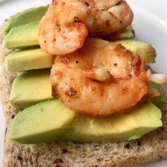 A picture of Bread,avacado and shrimp.