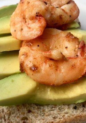 A picture of Bread,avacado and shrimp.