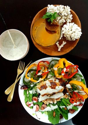 A picture of Yoghurt paprika tilapia with blue cheese dressing.