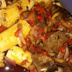 A picture of Boiled plantain with palmoil sauce.