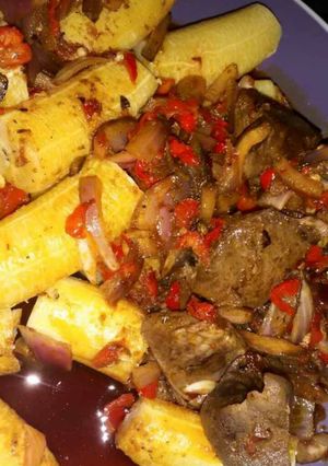 A picture of Boiled plantain with palmoil sauce.