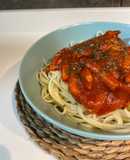 Spaghetti con tomate y bacon