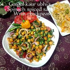 A picture of Spinach spiced salad with chickpeas 🥬🍅🧅.