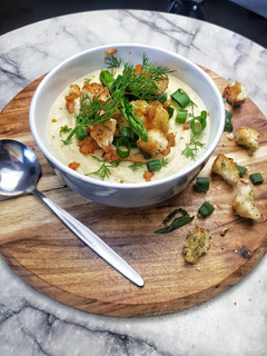 A picture of Vegan cheesy roast cauliflower soup.