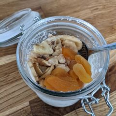 A picture of Coconut overnight oats with banana and apricots.