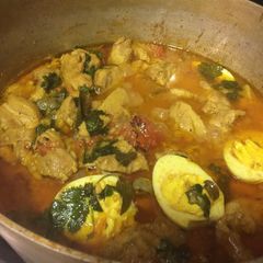 A picture of Chicken Korma and Hard Boiled Eggs.