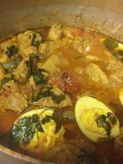 A picture of Chicken Korma and Hard Boiled Eggs.