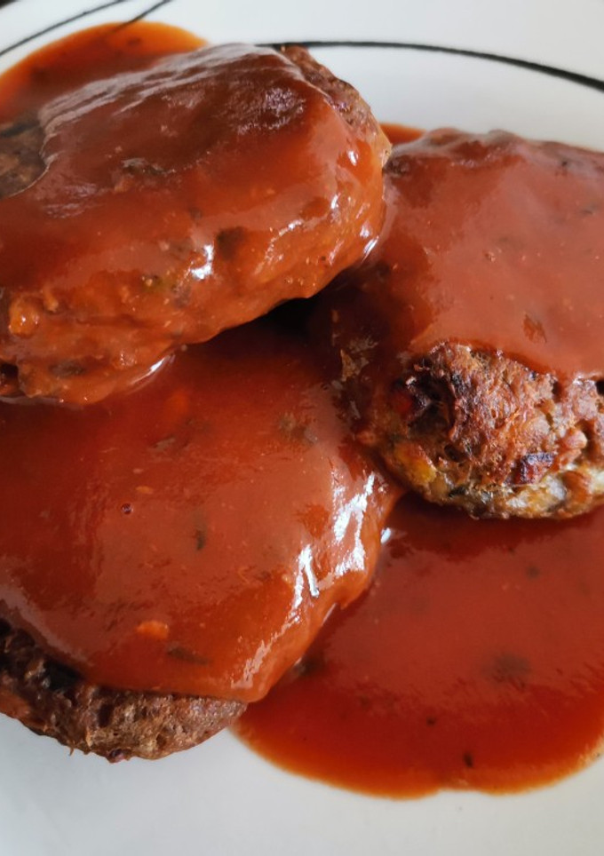 Una foto de Croquetas de jurel con salsa en su jugo