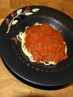 A picture of Shrimp on Pasta with Marinara Sauce.