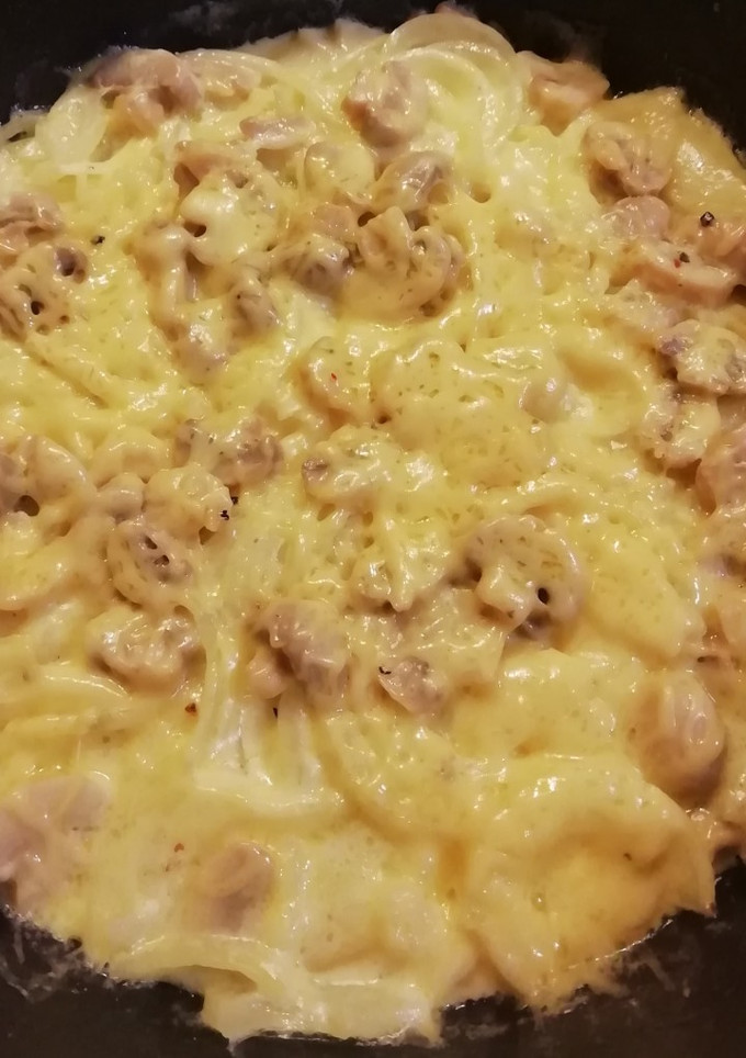 Una foto de Papas a la crema con cebolla y champiñones