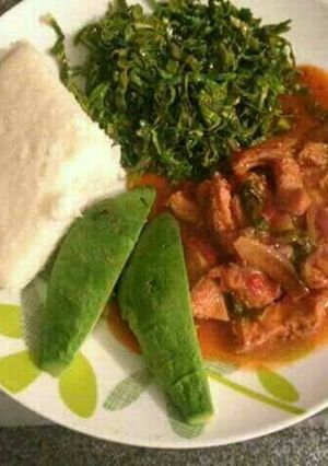 A picture of Ugali with beef and. Kales avacado.