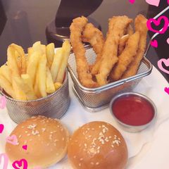 A picture of Chicken Strips with fries.