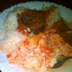 A picture of Steamed rice and mud fish stew.