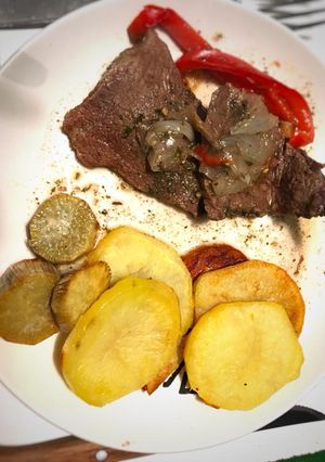 Una foto de Bifes a la criolla