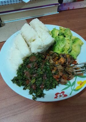 A picture of Kenyan Ugali with Sukuma Wiki and Beef Stew.