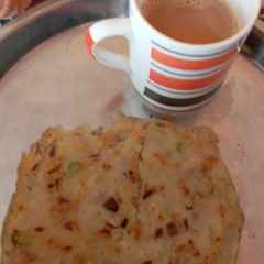 A picture of Suji ka chilla and tea.