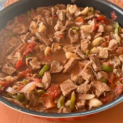 A picture of Lebanese style Mutton meat with veggies.