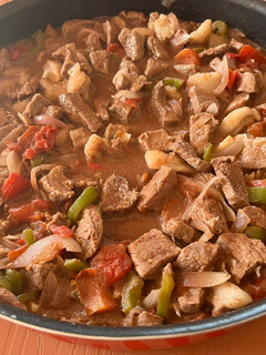 A picture of Lebanese style Mutton meat with veggies.