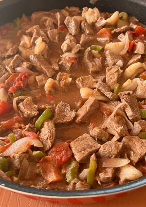 A picture of Lebanese style Mutton meat with veggies.