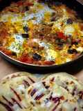 Shakshuka con pan naan