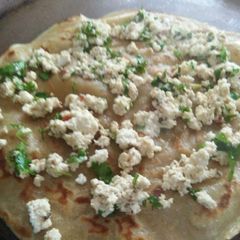 A picture of Paneer stuffed wheat dosa.