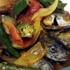 A picture of Fish in TT Sauce (ikan basung in turmeric & tamarind sauce).