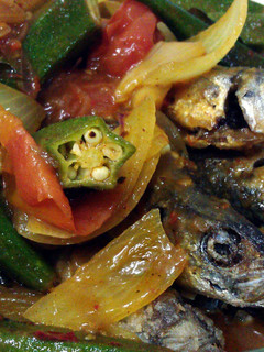 A picture of Fish in TT Sauce (ikan basung in turmeric & tamarind sauce).