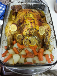 A picture of WHOLE BAKE CHICKEN WITH POTATOES AND CARROTS.