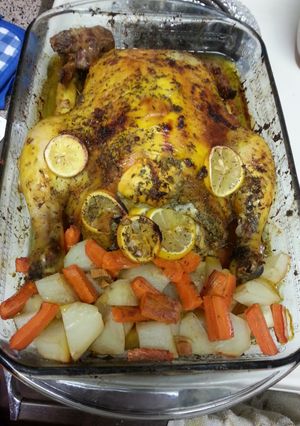 A picture of WHOLE BAKE CHICKEN WITH POTATOES AND CARROTS.
